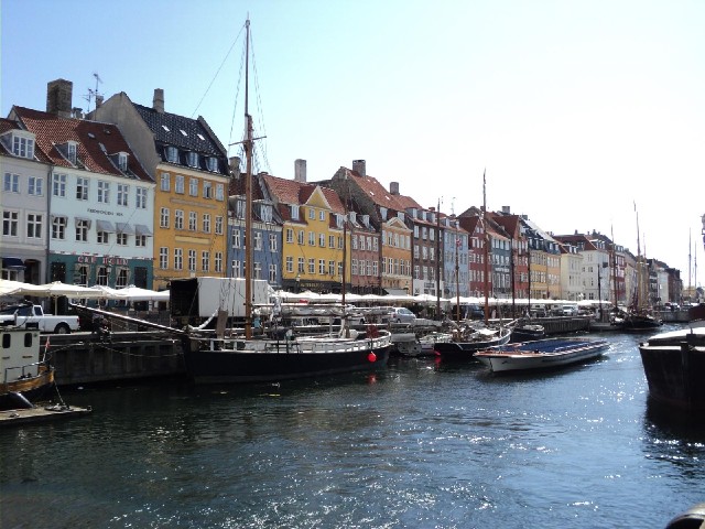 Nyhavn. The sightseeing boat coming up the middle looks strangely flat. I suppose it has to get unde...