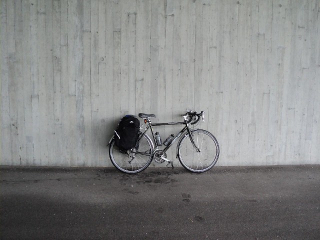 The bike sheltering from the rain for the moment, although it would get very wet on the way from her...