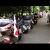 Here are some Polish flags on motorbikes. I just saw the bikers carrying some kind of wreath up to t...