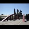 The Archcathedral Basilica of St. Peter and St. Paul with a bridge for pedestrians and cyclists over...