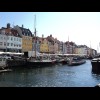 Nyhavn. The sightseeing boat coming up the middle looks strangely flat. I suppose it has to get unde...