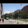 A wide boulevard in Copenhagen. The cycle lane runs under the rubbish chute, between the buildings a...