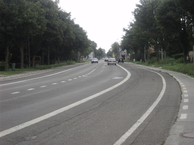 This is a fairly typical Belgian main road. There's only one lane for traffic in each direction. The...