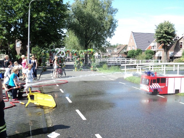 The fire brigade have brought this event where you have to spray water from a hose into the pipes on...