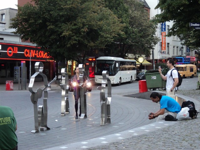 It's the Beatles again, this time in Beatles-Platz on the Reeperbahn. The woman there is pretending ...