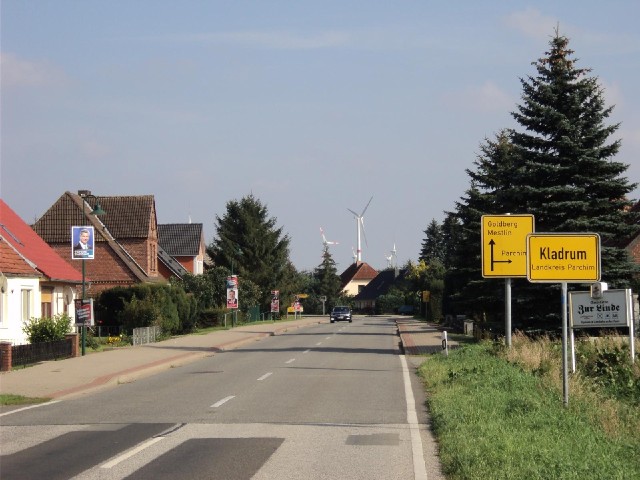 A village with wind turbines.