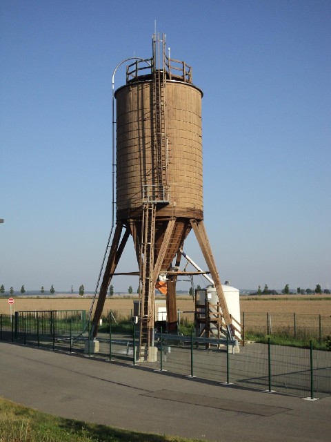 That looks like a wooden silo for storing something.