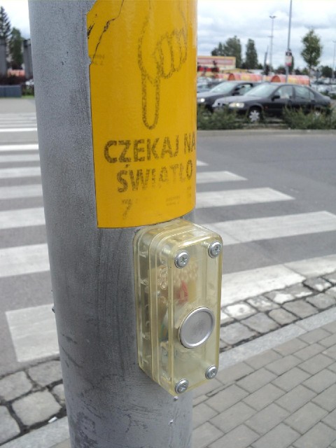 The pedestrian crossing buttons here are transparent.