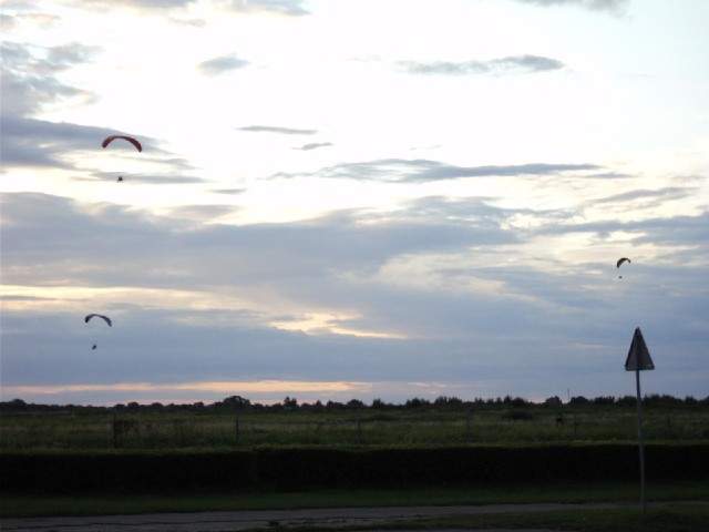 These powered paragliders seemed to be practising for some kind of display. One of them was towing a...