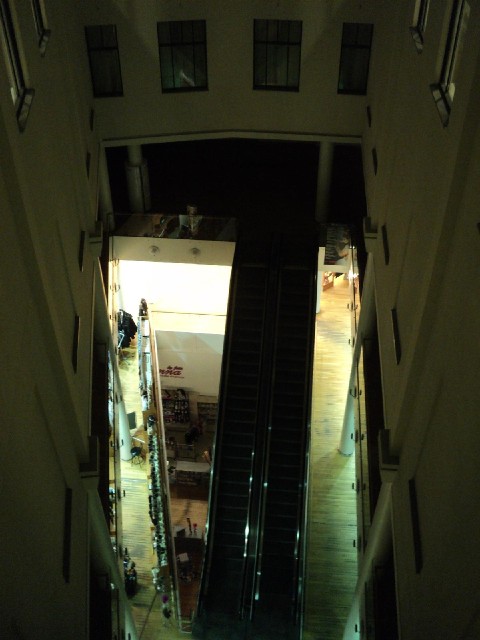 From that waiting room, and from the corridor which connects it to the lifts, you can look down into...