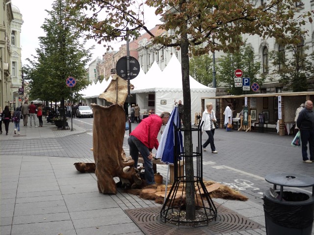 At this end of the street are some people selling wood carvings.