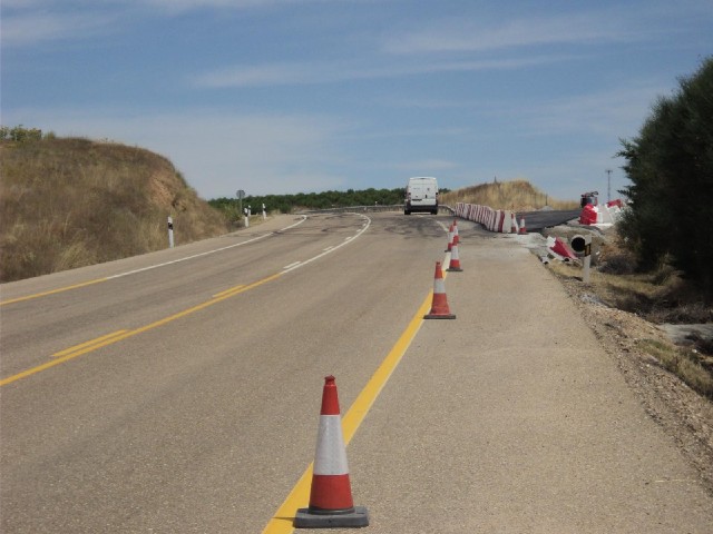 In Spain, where there are roadworks, the road markings and the backgrounds of the signs are yellow w...