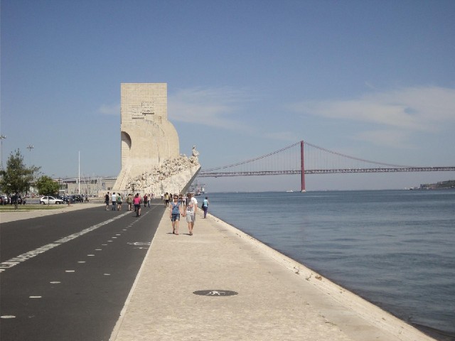 The coastal cycle way, the Explorers' Monument and the 25th of April Bridge.