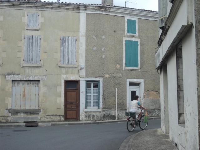 One of many people who I have seen each morning in France taking baguettes home from the baker's. Th...