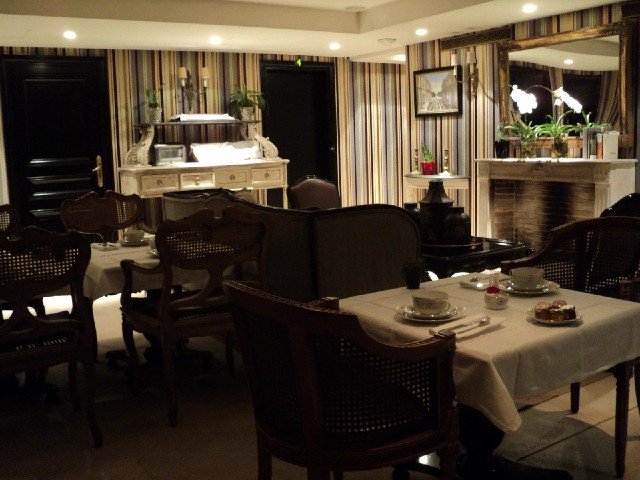 The breakfast room. The black door on the left is one of the bedrooms. I don't think I've seen a hot...