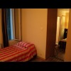 My room is odd too. There's a big bed in one room and two small beds in this room up a couple of ste...