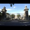 Another entrance into the grounds of the Palace of Versailles. What looks like a grey wall beyond th...