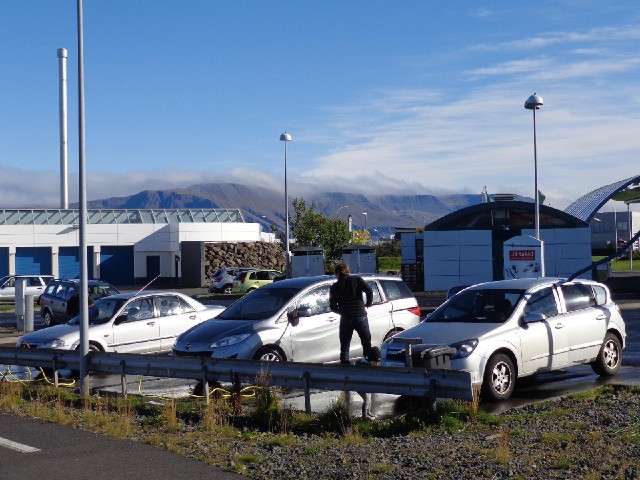 A car wash, with mist rolling over the mountains in the distance.