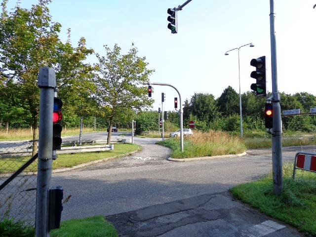 There are a lot of traffic lights at this junction. Here, I have to push a button to let the lights ...