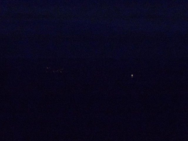 A rather blurry view of the Norwegian coast. The bright dots are lighthouses.