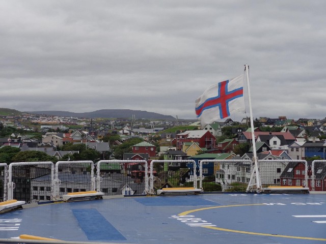 The ship's flag now flying over its own islands.