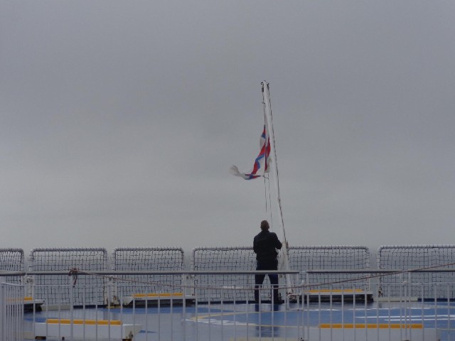 The flag goes up again as we near the harbour.