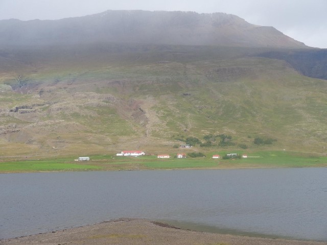 Buildings on the other side of the fjord. I think there's a feint rainbow too, about two thirds of t...
