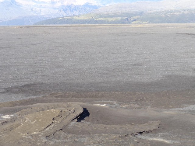 Now I start to cross a large expanse of this black volcanic sand.