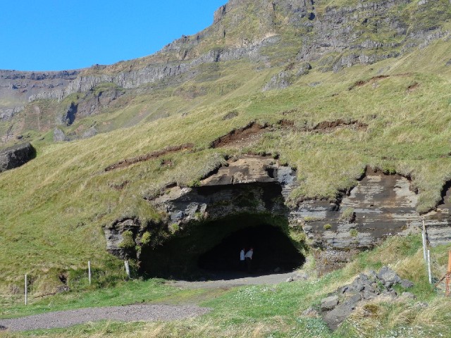 More tourists, this time investigating a cave.