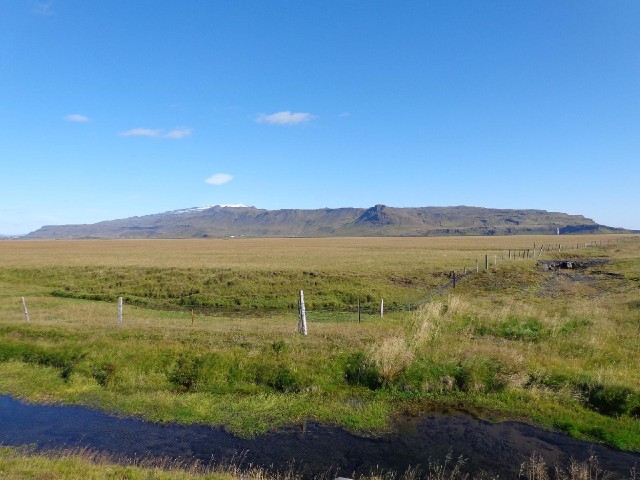 Eyjafjallajkull is on the left. Seljalandsfoss is the vertical white stripe on the right.
