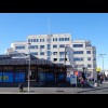 A deco building behind the bus station.