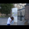 A tourist taking a photograph of a map for later reference. I used to do this a lot before I could g...
