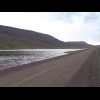 The road passing a lake.