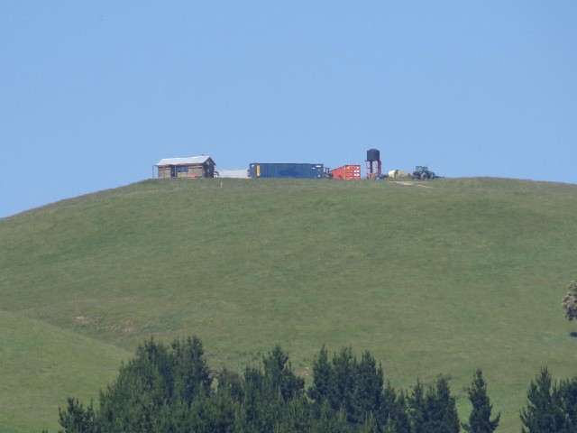 A farm on a hill.