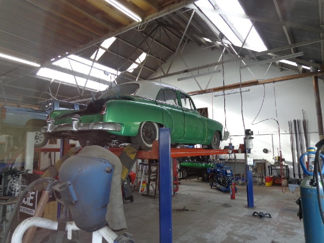 An old car being renovated.