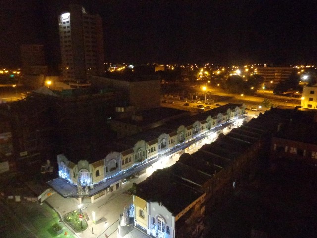 At night, you can see that many of the buildings which are still standing are abandoned and dark.