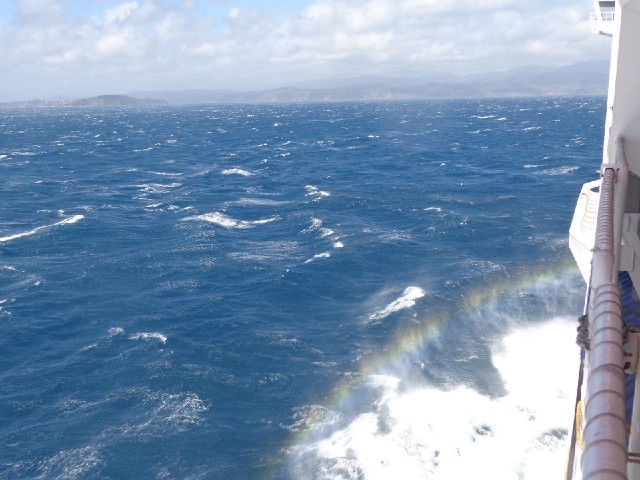 A rainbow in the spray of the bow wave.