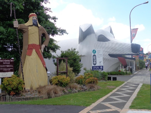 The shepherd statue belongs to a church. The giant dog is the tourist information centre and toilets...
