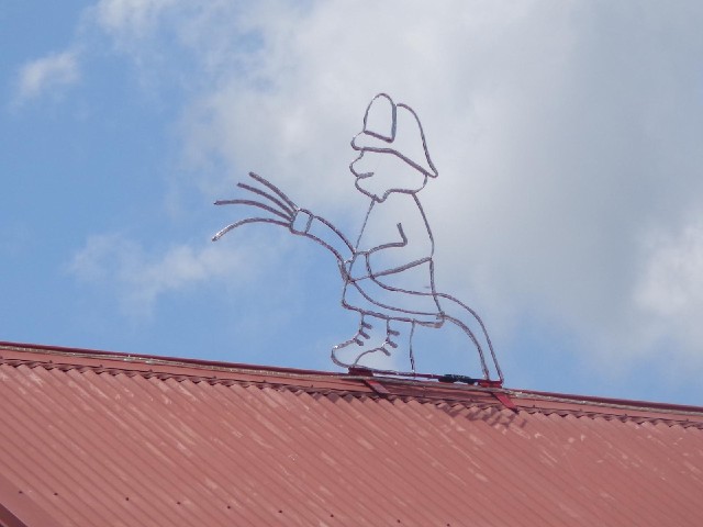 A decoration on the roof of the fire station.