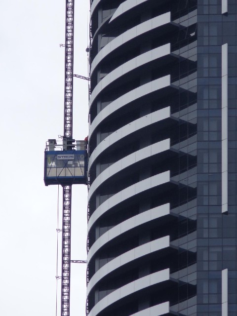 Work taking place on the nearly-complete Meriton building.