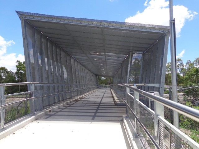 A bridge over the railway. According to a plaque, it's only been here for a couple of years.