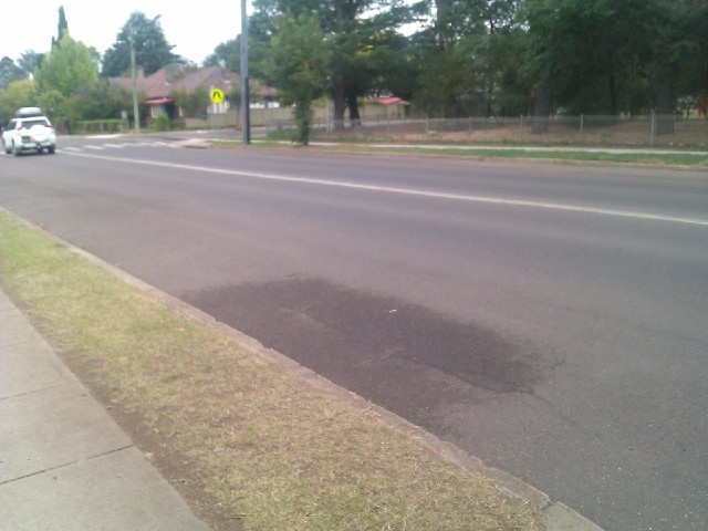 This is unusual. Normally if it has been raining and then a car drives off, it leaves a dry patch. H...
