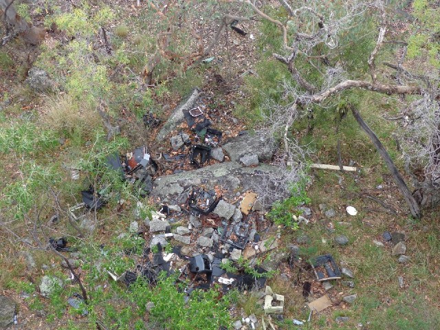 If you look straight down, you see all these broken television sets which look like they have been c...