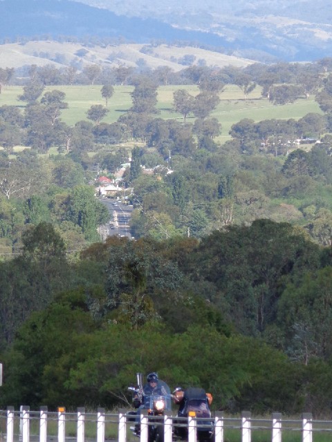 A motorbike and sidecar in the foreground, with part of the town of Murrurundi in the distance.