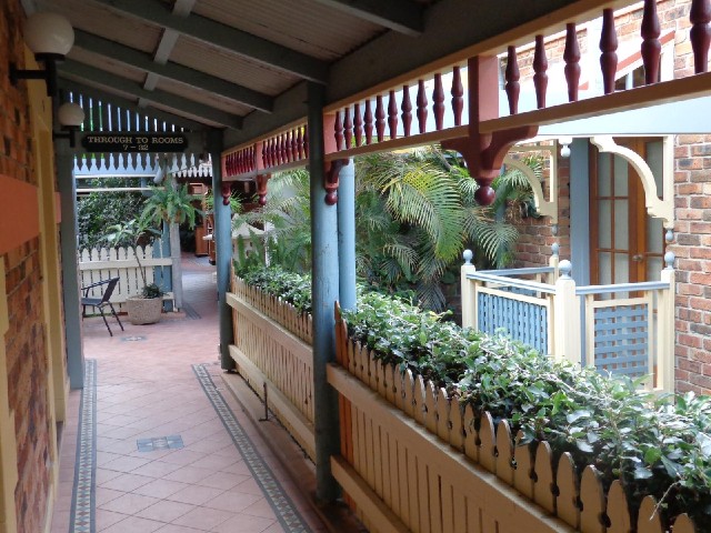 In the resort. Between the hedge and the balcony, you can look down to where some of the cafes are.