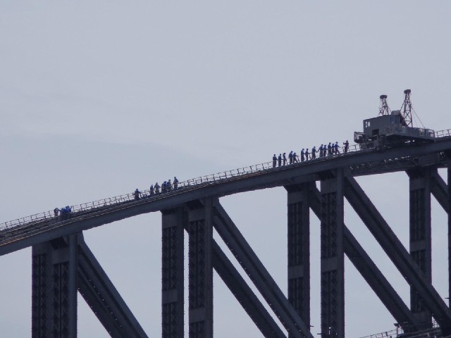 People climbing the bridge.