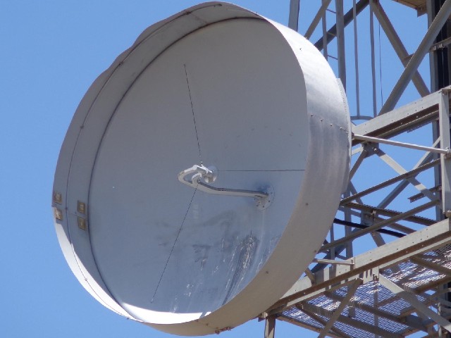 A dish up a big mast. I don't know what the shield around it is for. It doesn't seem to have kept th...