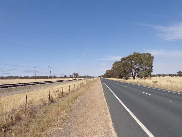 The road and the railway. I've been riding alongside this railway for nearly two hours and haven't s...