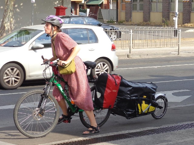 The serious touring luggage doesn't really seem to match the clothes.