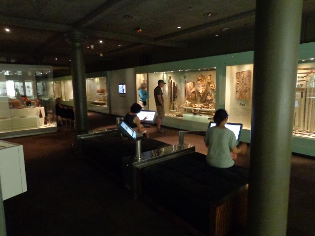 People using interactive displays in the museum.
